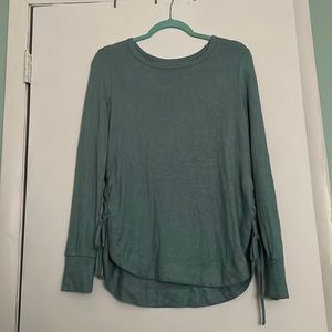 Cozy top size medium, tied sides. Greenish blue